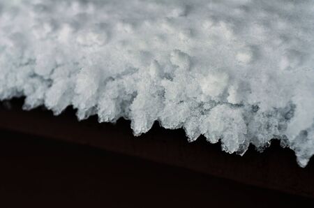 An icicles at Stowe, Vermont ski resort with frosted snow