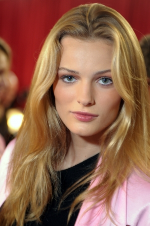 NEW YORK - NOVEMBER 10: Victoria's Secret model  Edita Vilkeviciute getting ready backstage  during the 2010 Victoria's Secret Fashion Show on November 10, 2010 at the Lexington Armory in New York. のeditorial素材
