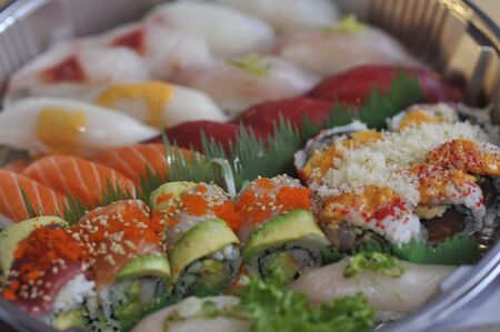 Sushi, sashimi, rolls on trayの写真素材