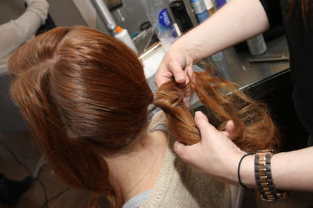 NEW YORK - APRIL 21: A Model gets ready backstage for Anne Barge bridalshow at The London Hotel during Bridal Fashion Week on April 21, 2013 in New York City のeditorial素材