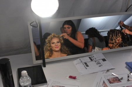 MIAMI - JULY 19: Model gets ready backstage at the Lisa Blue Collection for Spring/ Summer 2013 during Mercedes-Benz Swim Fashion Week on July 19, 2012 in Miami, FL のeditorial素材