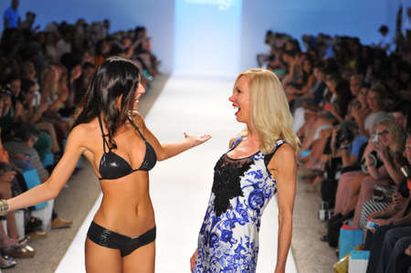 MIAMI - JULY 22: Designer Elisabeth Southwood and Model walks runway finale at the Sauvage Collection for Spring/ Summer 2014 during Mercedes-Benz Swim Fashion Week on July 22, 2013 in Miami, FL のeditorial素材