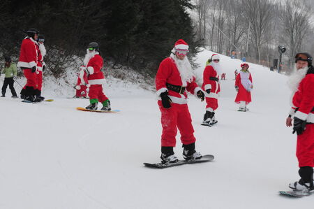 WINDHAM DECEMBER 19 - Skiing and Riding Santas for charity at Windham Mountain. Windham Mountain, Windham NY December 19, 2010のeditorial素材