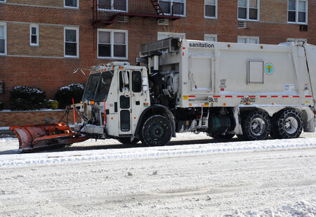Sanitation tracks cleaning streets in Brooklyn is seen after the seasons first snow storm in NYCのeditorial素材