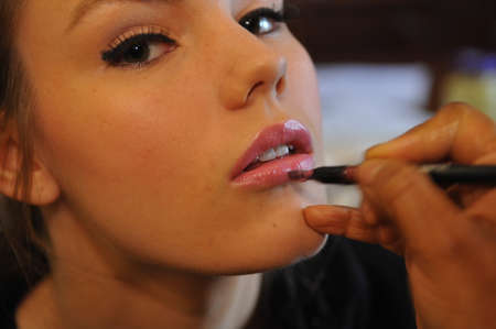 NEW YORK, NY - APRIL 12: A model gets ready backstage before the Jenny Lee Spring 2015 Bridal collection show on April 12, 2014 in New York City.のeditorial素材