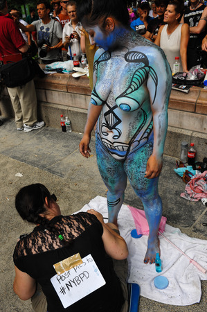 NEW YORK - JULY 26: Nude models, artists take to New York City streets during first official Body Painting Event featuring artist Andy Golub on July 26, 2014 in New York NYのeditorial素材