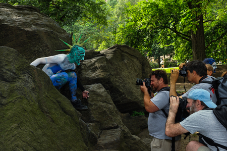 NEW YORK - JULY 26: Nude models, artists take to New York City streets during first official Body Painting Event featuring artist Andy Golub on July 26, 2014 in New York NYのeditorial素材
