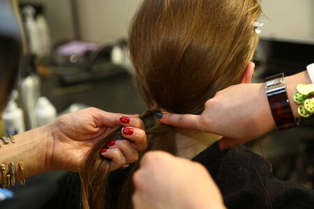 MILAN, ITALY - SEPTEMBER 20: A model getting ready backstage before the Mila Schon fashion show as part of Milan Fashion Week Womenswear Spring-Summer 2015 on September 20, 2014 in Milan, Italy.のeditorial素材