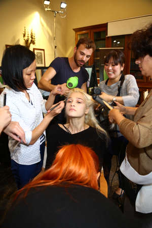MILAN, ITALY - SEPTEMBER 20: A model gets ready backstage before the Genny fashion show as part of Milan Fashion Week Womenswear Spring-Summer 2015 on September 20, 2014 in Milan, Italy.のeditorial素材