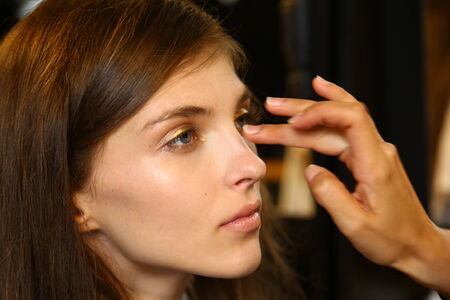 MILAN, ITALY - SEPTEMBER 20: A model gets ready backstage before the Genny fashion show as part of Milan Fashion Week Womenswear Spring-Summer 2015 on September 20, 2014 in Milan, Italy.のeditorial素材