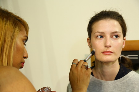 MILAN, ITALY - SEPTEMBER 20: A model getting ready backstage before the Mila Schon fashion show as part of Milan Fashion Week Womenswear Spring-Summer 2015 on September 20, 2014 in Milan, Italy.のeditorial素材