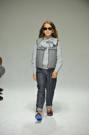 NEW YORK, NY - OCTOBER 18: A model walks the runway during the Parsons preview at petite PARADE Kids Fashion Week at Bathhouse Studios on October 18, 2014 in New York City.のeditorial素材
