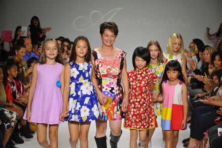 NEW YORK, NY - OCTOBER 19: Designer Peini Yang (C) walks the runway with models during the Aria Children's Clothing preview at petitePARADE  Kids Fashion Week at Bathhouse Studios on October 19, 2014 in New York City.のeditorial素材