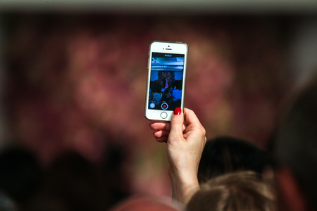 NEW YORK, NY - SEPTEMBER 09: A guest holding a cellphone and making pictures at the Oscar De La...