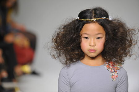 NEW YORK, NY - OCTOBER 19: A model walks the runway during the Charm preview at petitePARADE  Kids Fashion Week at Bathhouse Studios on October 19, 2014 in New York City.のeditorial素材