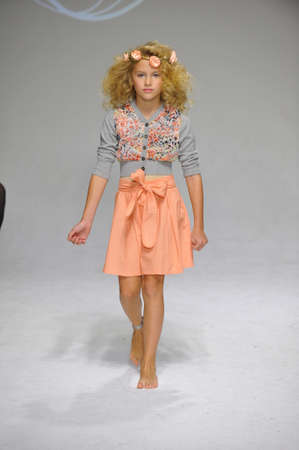 NEW YORK, NY - OCTOBER 19: A model walks the runway during the Charm preview at petitePARADE  Kids Fashion Week at Bathhouse Studios on October 19, 2014 in New York City.のeditorial素材