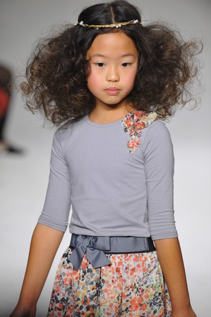 NEW YORK, NY - OCTOBER 19: A model walks the runway during the Charm preview at petitePARADE  Kids Fashion Week at Bathhouse Studios on October 19, 2014 in New York City.のeditorial素材