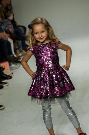 NEW YORK, NY - OCTOBER 19: A model walks the runway during the Clarks preview at petitePARADE Kids Fashion Week at Bathhouse Studios on October 19, 2014 in New York City.のeditorial素材