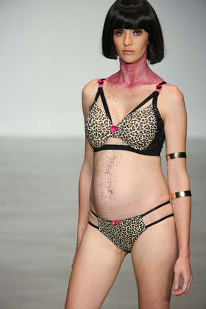 NEW YORK, NY - OCTOBER 25: A pregnant model walks runway during You! Lingerie Spring 2015 show during Lingerie Fashion Week at the Center 548 on October 25, 2014 in New York City.のeditorial素材