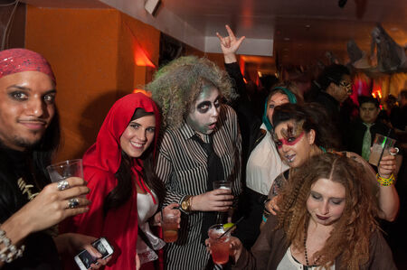 NEW YORK, NY - OCTOBER 31: Guests in mascarade costumes posing at The Fashion Party during Halloween event at the West Village Crema Restaurant on October 31, 2014 in New York City.のeditorial素材