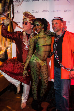NEW YORK, NY - OCTOBER 31: Guests in mascarade costumes posing at The Fashion Party during Halloween event at the West Village Crema Restaurant on October 31, 2014 in New York City.のeditorial素材