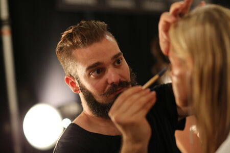 NEW YORK, NY - SEPTEMBER 06: A model has her make-up done backstage at Venexiana during Mercedes-Benz Fashion Week Spring 2015 at Lincoln Center on September 6, 2014 in NYCのeditorial素材
