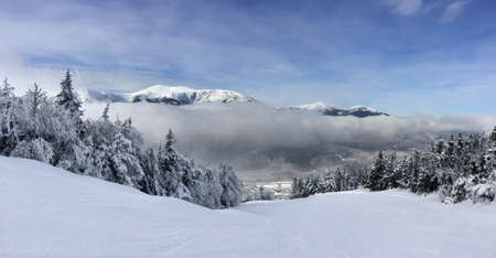 Snowy slope in the mountainsの写真素材