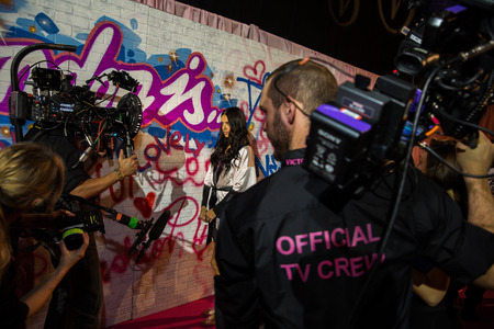 LONDON, ENGLAND - DECEMBER 02: Official TV Crew working backstage at the annual Victoria's Secret fashion show at Earls Court on December 2, 2014 in London, England.のeditorial素材