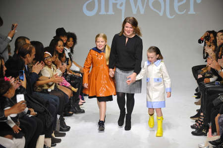 NEW YORK, NY - OCTOBER 18: Designer Amy Wismar walks the runway with models during the Oil & Water preview at petitePARADE / Kids Fashion Week at Bathhouse Studios on October 18, 2014 in New York City.のeditorial素材