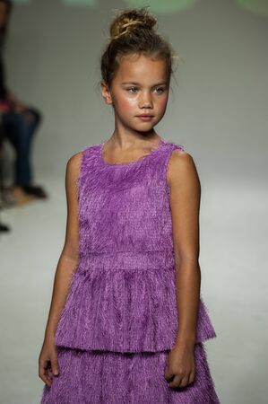 NEW YORK, NY - OCTOBER 19: A model walks the runway during the Ruum preview at petitePARADE / Kids Fashion Week at Bathhouse Studios on October 19, 2014 in New York City.のeditorial素材