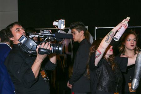 NEW YORK, NY - FEBRUARY 15: A model getting ready backstage at the FTL Moda fashion show during MBFW Fall 2015 at The Salon at Lincoln Center on February 15, 2015 in NYC.のeditorial素材