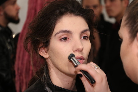 NEW YORK, NY - FEBRUARY 19: A model getting ready backstage at the SERGIO DAVILA fashion show during Mercedes-Benz Fashion Week Fall 2015 at The Pavilion at Lincoln Center on February 19, 2015 in NYC.のeditorial素材