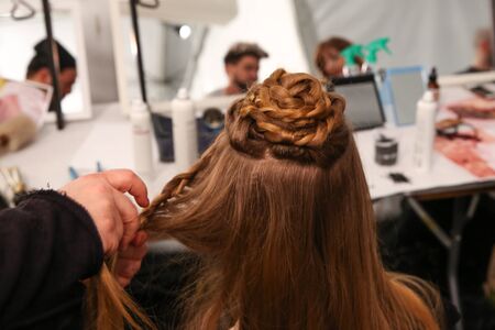 NEW YORK, NY - FEBRUARY 15: A model getting ready backstage at the FTL Moda fashion show during MBFW Fall 2015 at The Salon at Lincoln Center on February 15, 2015 in NYC.のeditorial素材
