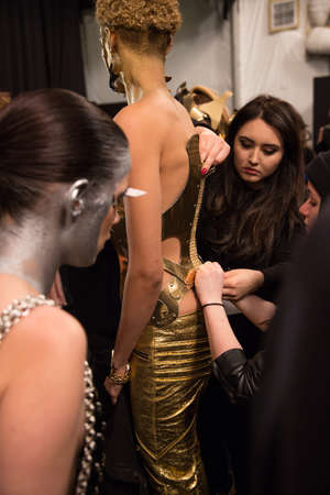 NEW YORK, NY - FEBRUARY 15: A model getting ready backstage at the FTL Moda fashion show during MBFW Fall 2015 at The Salon at Lincoln Center on February 15, 2015 in NYC.のeditorial素材