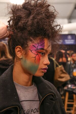 NEW YORK, NY - FEBRUARY 15: A model getting ready backstage at the FTL Moda fashion show during MBFW Fall 2015 at The Salon at Lincoln Center on February 15, 2015 in NYC.のeditorial素材