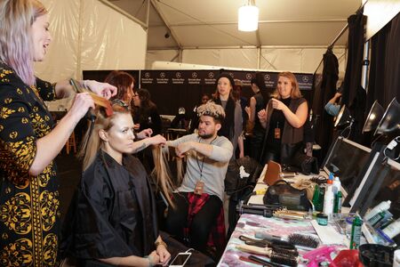 NEW YORK, NY - FEBRUARY 15: A model getting ready backstage at the FTL Moda fashion show during MBFW Fall 2015 at The Salon at Lincoln Center on February 15, 2015 in NYC.のeditorial素材