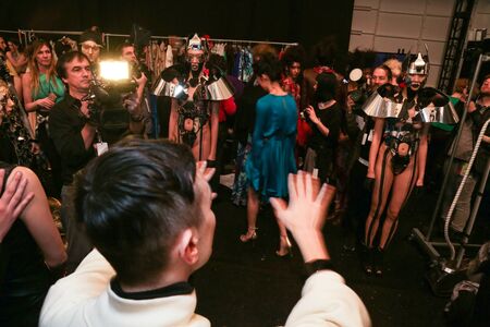 NEW YORK, NY - FEBRUARY 15: A model getting ready backstage at the FTL Moda fashion show during MBFW...