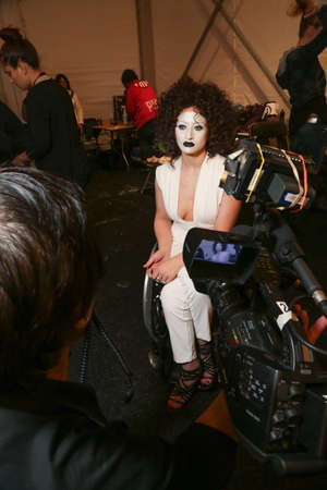 NEW YORK, NY - FEBRUARY 15: A model getting ready backstage at the FTL Moda fashion show during MBFW Fall 2015 at The Salon at Lincoln Center on February 15, 2015 in NYC.のeditorial素材
