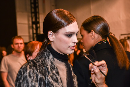 NEW YORK, NY - FEBRUARY 13: A model getting ready backstage at the Nicole Miller fashion show during MBFW Fall 2015 at Lincoln Center on February 13, 2015 in NYC.のeditorial素材