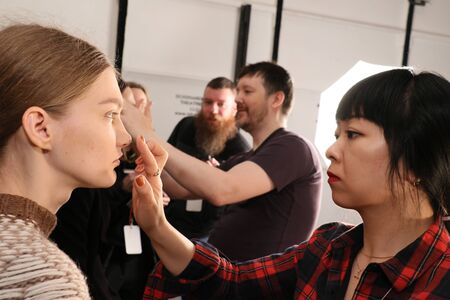 NEW YORK, NY - FEBRUARY 13: A model getting ready backstage at the Sally LaPointe Fashion show during MBFW Fall 2015 at Skylight Modern on February 13, 2015 in NYC.のeditorial素材