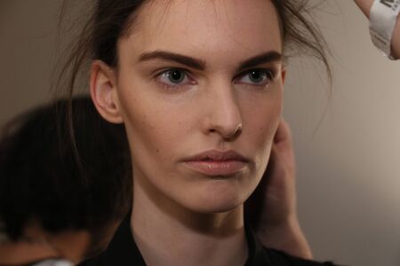 NEW YORK, NY - FEBRUARY 13: A model getting ready backstage at the Sally LaPointe Fashion show during MBFW Fall 2015 at Skylight Modern on February 13, 2015 in NYC.のeditorial素材