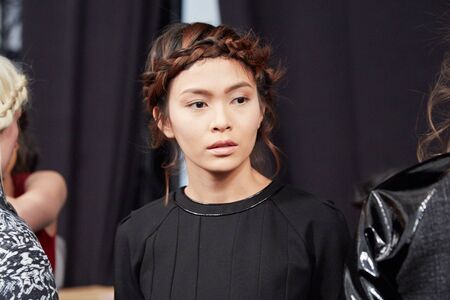 NEW YORK, NY - FEBRUARY 19: A model getting ready backstaget at the New York Life fashion show during MBFW Fall 2015 at Lincoln Center on February 19, 2015 in NYC.のeditorial素材