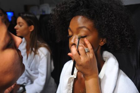 MIAMI, FL - JULY 19: A model getting ready backstage at the Mara Hoffman Swim fashion show during MBFW Swim 2015 at The Raleigh hotel on July 19, 2014 in Miami, FL.のeditorial素材