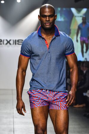 NEW YORK, NY - OCTOBER 14: Model walks the runway during 2(X)IST Men's Spring/Summer 2016 Runway...