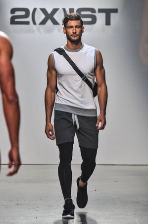 NEW YORK, NY - OCTOBER 14: Model walks the runway during 2(X)IST Men's Spring/Summer 2016 Runway...