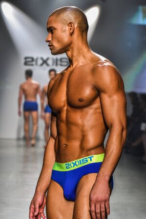 NEW YORK, NY - OCTOBER 14: Model walks the runway during 2(X)IST Men's Spring/Summer 2016 Runway Show at Skyline Modern on October 14, 2015 in NYCのeditorial素材