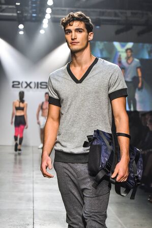 NEW YORK, NY - OCTOBER 14: Model walks the runway during 2(X)IST Men's Spring/Summer 2016 Runway...
