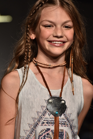 NEW YORK, NY - OCTOBER 17: A model walks runway at Jessica Simpson Collection Fall/Winter 2016 Runway Show during petiteParade at The Spring Studio on October 17, 2015 in NYC.のeditorial素材