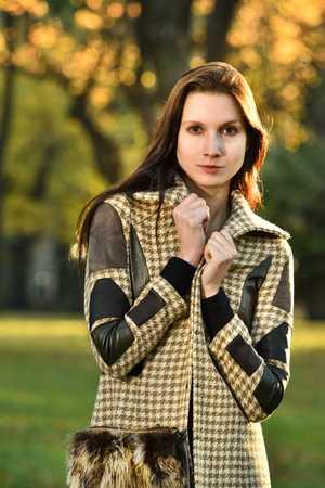 Attracttive young model posing at Central Park New York location for fall fashion photo shoot.の写真素材