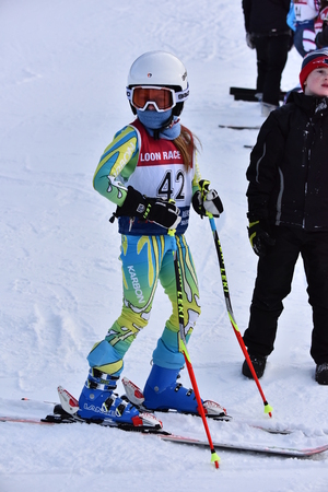 LOON MOUNTAIN USA - JANUARY 24: Tina Sutton Memorial - Slalom Ski Competition. Unidentified participant of junior ski race on January 24, 2016 at the Loon Mountain in New Hampshire, USAのeditorial素材